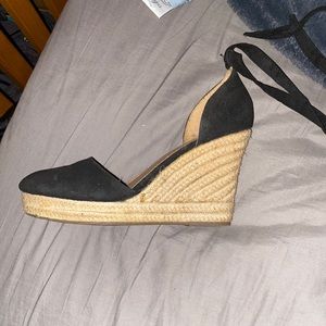 A black wrap around brash wedge shoes size 9